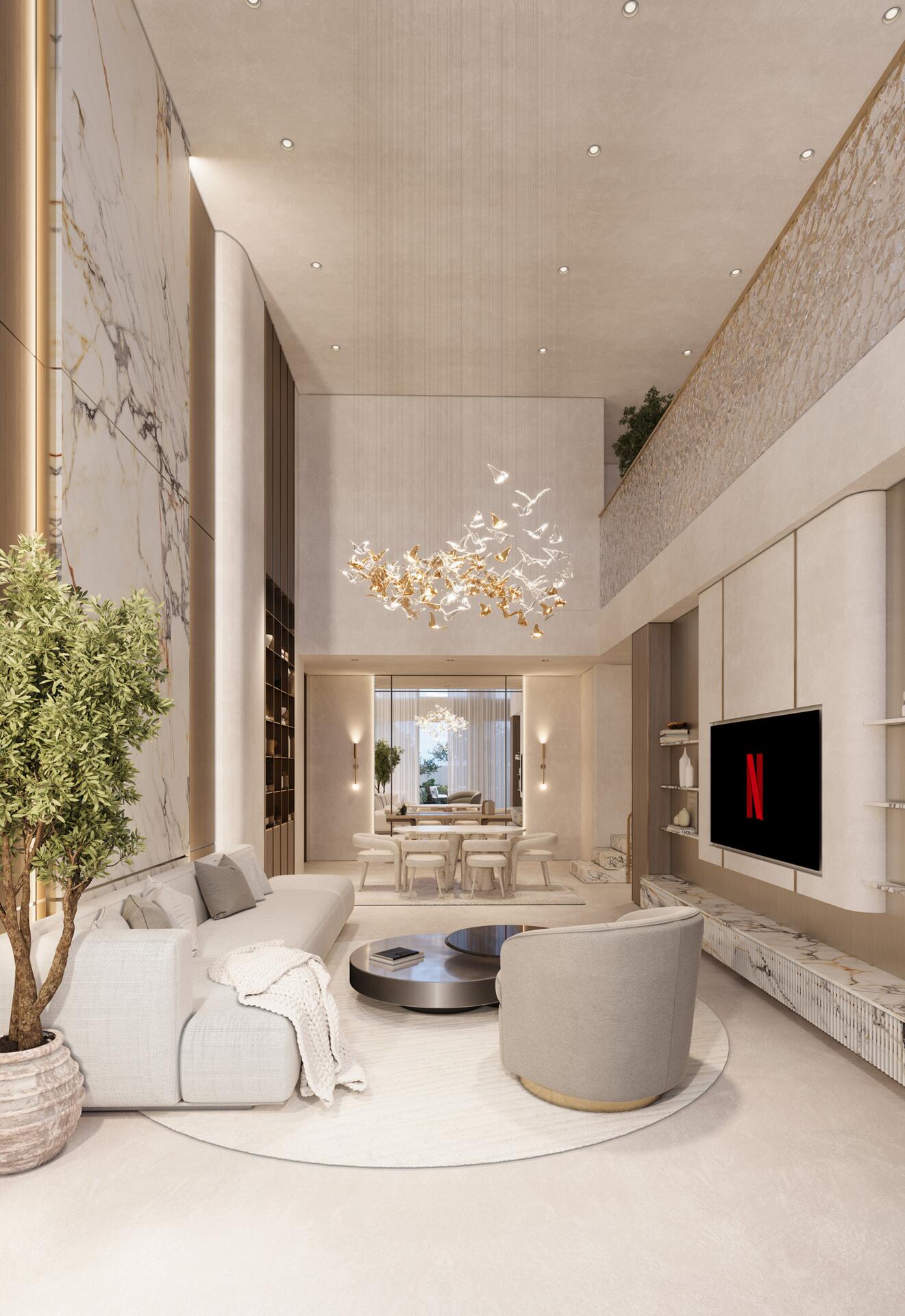 Double-height living space with marble feature wall and chandelier